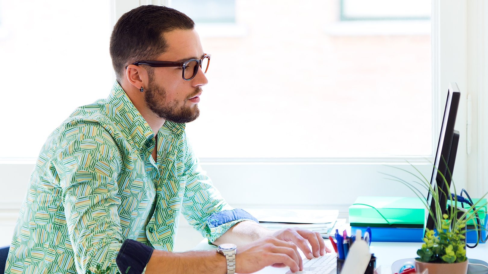 Guy working at a computer - tax time